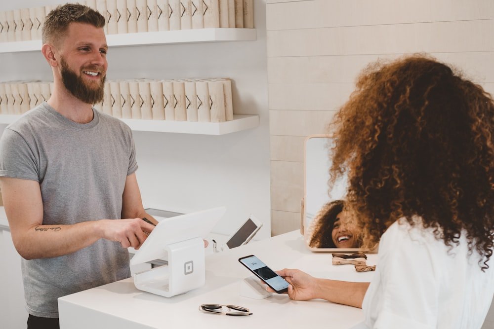 Small business owner interacting with customers